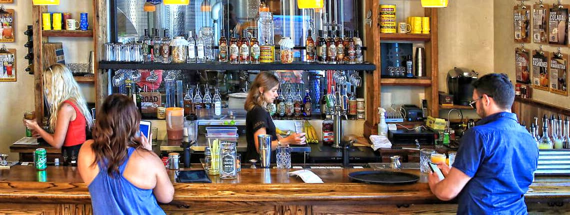 Mississippi River Distilling Co. bar and patrons