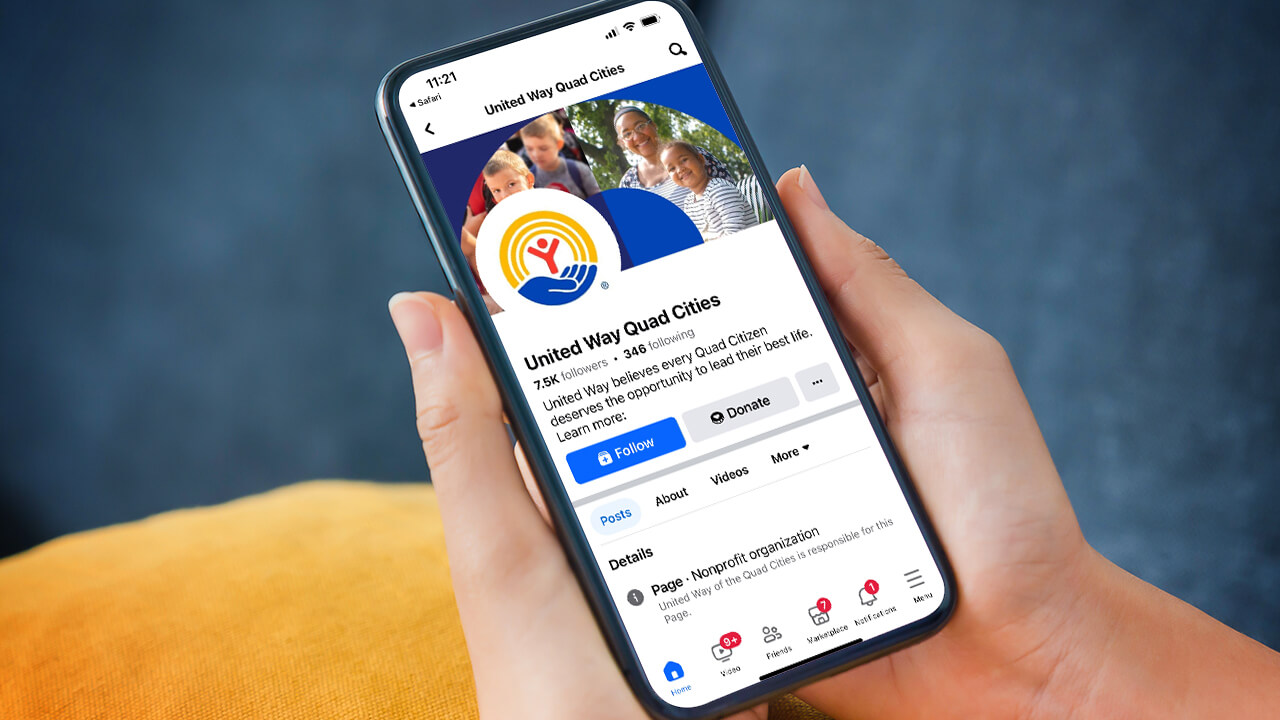 United Way of the Quad Cities Facebook page displayed on a mobile phone