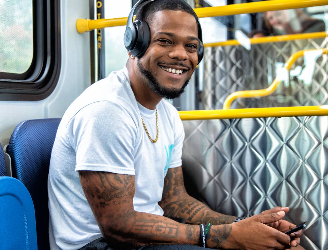 Man with headphones on MetroLINK bus